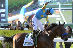 Victor Espinoza reacts after crossing the finish line with American Pharoah (5) to win the 147th running of the Belmont Stakes horse race at Belmont Park, Saturday, June 6, 2015, in Elmont, N.Y.  American Pharoah is the first horse to win the Triple Crown since Affirmed won it in 1978.(AP Photo/Bill Kostroun)